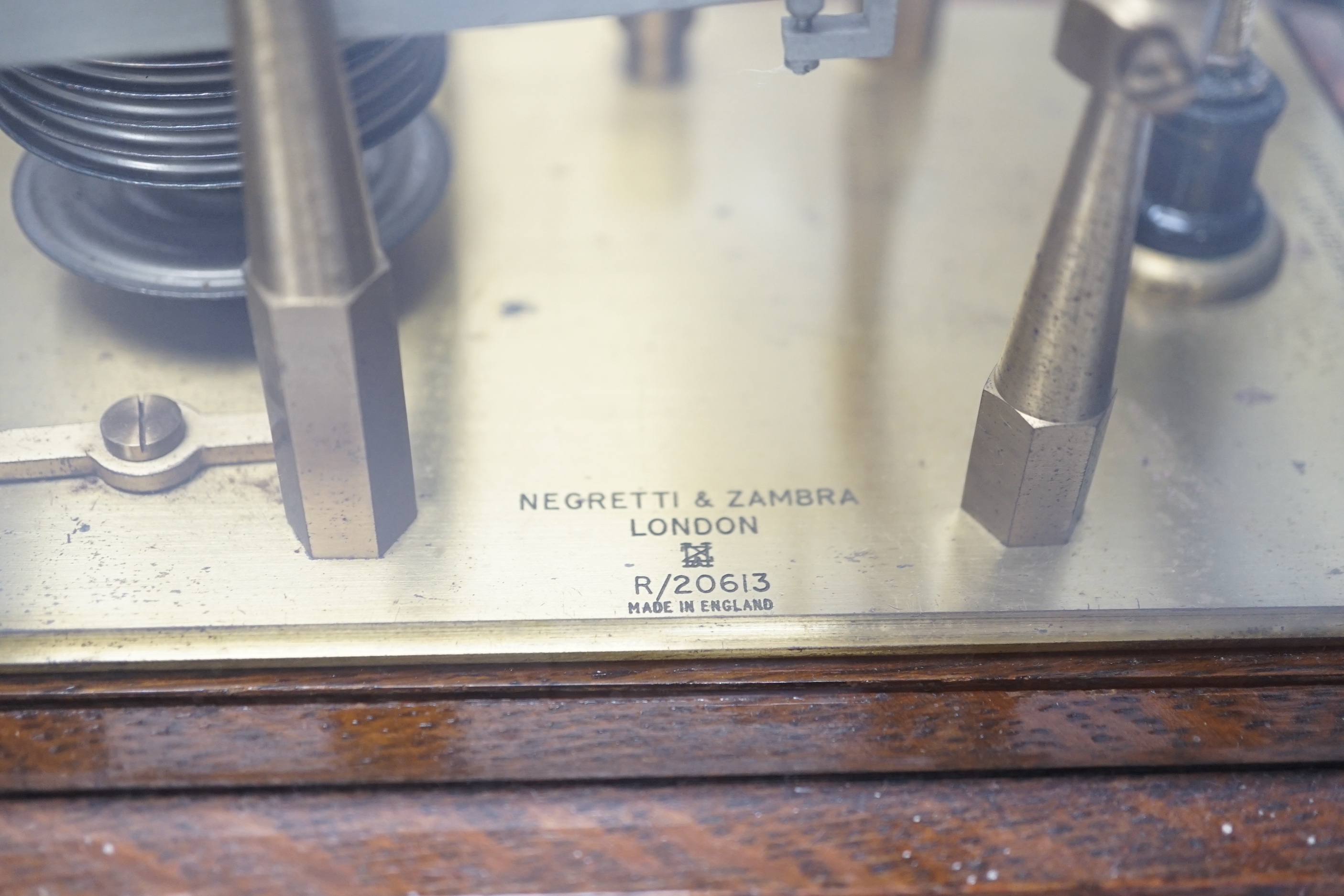 A Negretti and Zambra oak-cased barograph, number R/20613 with plaque reading ‘To C.C. Prigge as a token of esteem from his C.P.C. and B&P friends, July 1949’